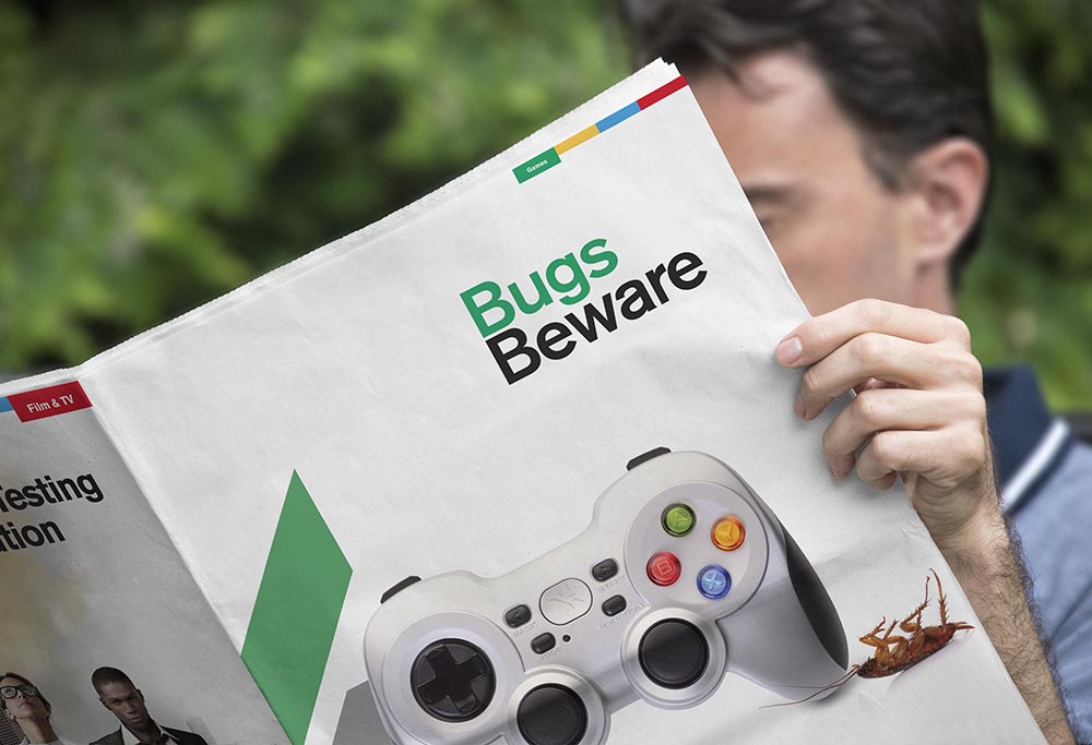 Testronic 'Bugs Beware' gaming advert held by a person