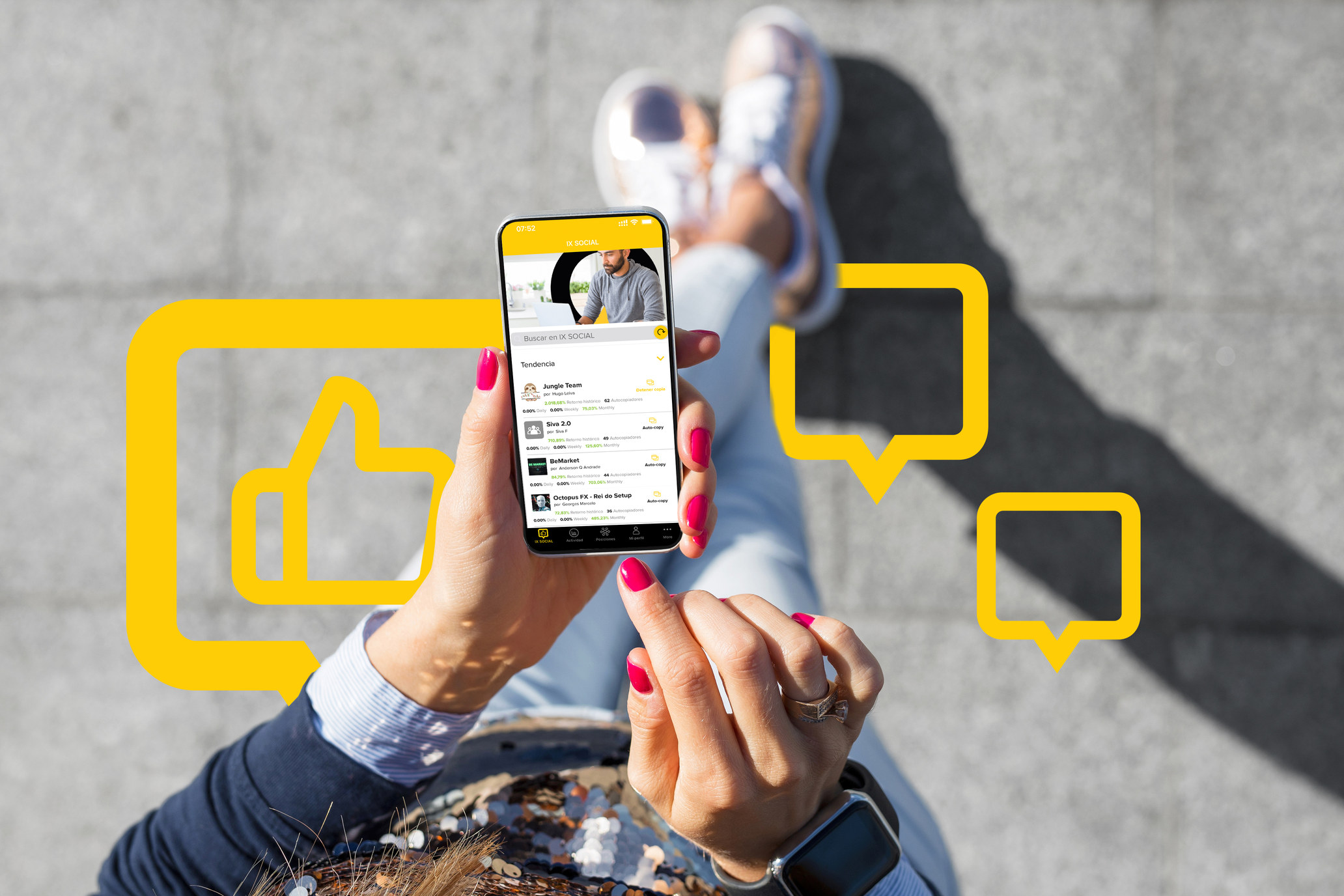 IX Social smartphone held overhead with yellow social icons