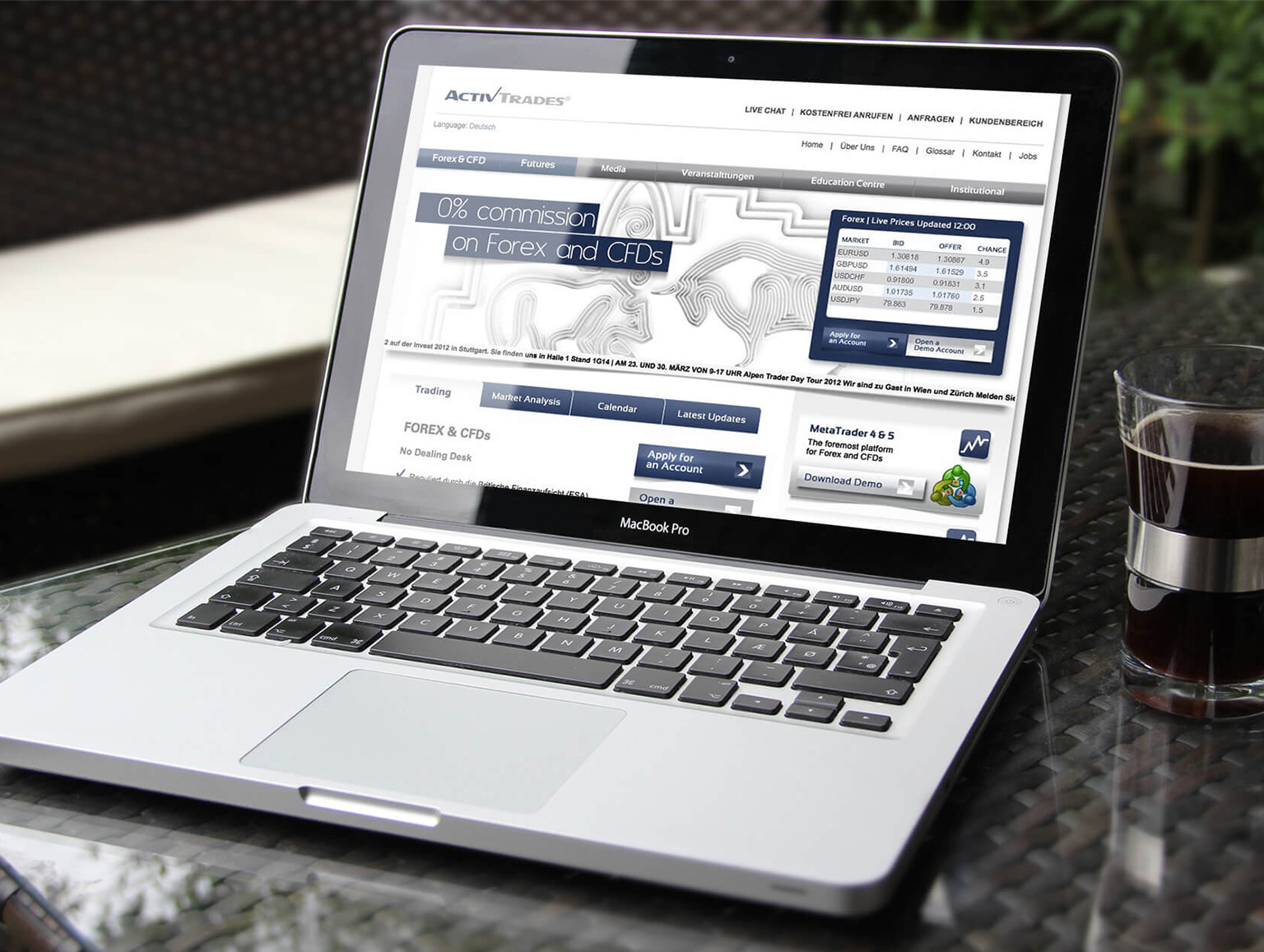 ActivTrades website displayed on a laptop