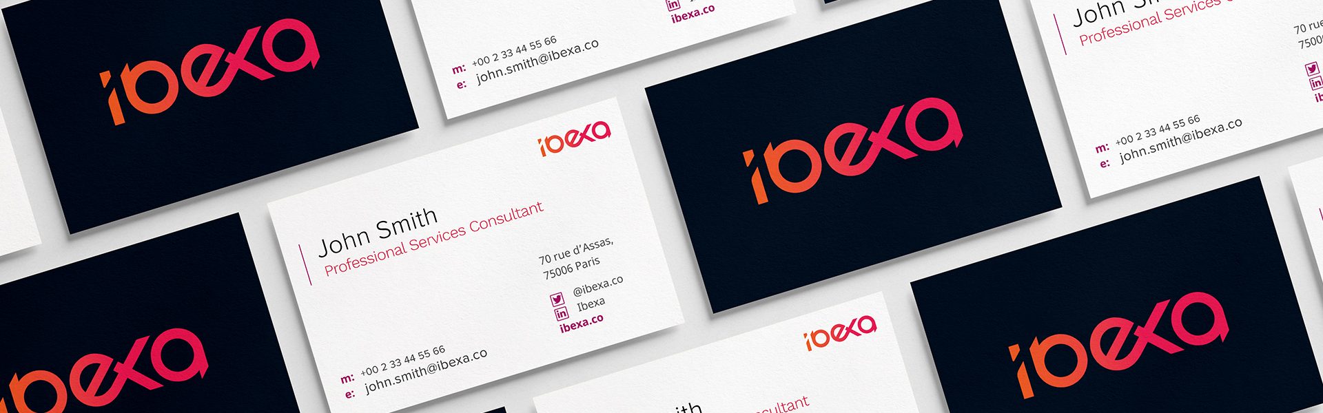 Ibexa business cards in dark navy and coral